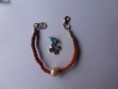 pulsera con cuerda de trenza y perla con cruz de plata. cod 26